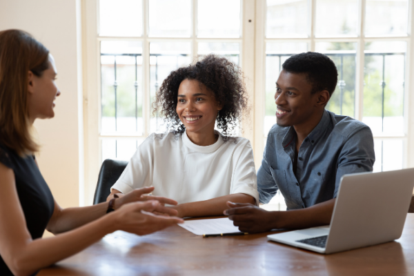 Couple Discussing Portfolio with Financial Advisor | Portfolio Management Services in Kansas City, St Louis, Denver | The Retirement Planning Group